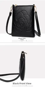 Detail of black pebbled leather crossbody bag with embossed rose pattern and gold hardware