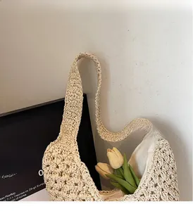 Close-up of beige paper rope woven bag showing detailed texture and soft fabric lining