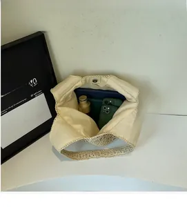 Interior view of woven beach tote showing large capacity and metal magnetic snap closure
