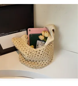 Large capacity woven paper rope beach bag showing spacious interior with personal items