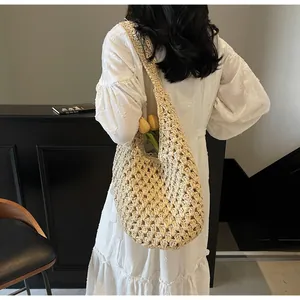 Detail of hollow paper rope woven bag with crochet texture and tulip decoration
