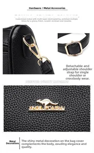 Detail of lychee pattern leather, golden metal hooks and adjustable shoulder strap buckle