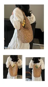 Close-up of hollow paper rope woven bag with flowers showing texture and shoulder strap