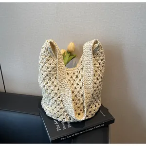Detail of hollow woven paper rope tote bag with bohemian floral pattern and fabric lining