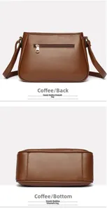 Detail view of coffee brown leather bag showing the back zipper pocket and widened flat bottom