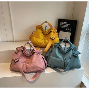 Detailed display of wrinkled nylon crossbody bags in three colors with dual front zippers