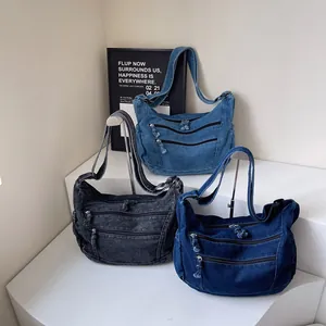 Retro denim tote bag for women in light blue, dark blue, and black with multiple zip pockets
