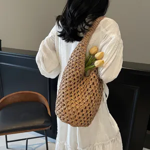 Handcrafted hollow paper rope woven shoulder bag for women beach vacation and daily use
