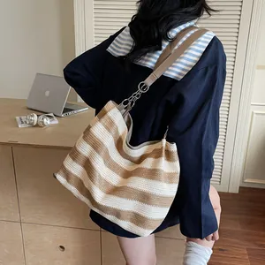 Striped woven hobo shoulder bag with brown leather strap and metal chain detail