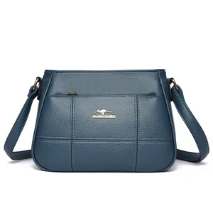 Blue quilted faux leather crossbody bag for middle-aged women with gold kangaroo emblem