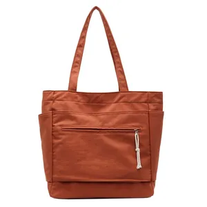 Sac fourre-tout en toile terre cuite avec poche zippée et fentes latérales pratiques