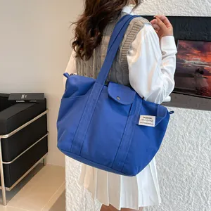 Minimalist large capacity navy blue canvas tote bag for women commuting and travel use