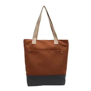 Large canvas tote bag with rust red and grey stitching and sturdy top handles