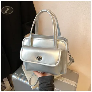 Close-up of metallic silver bowling bag with metal twist-lock and top handle