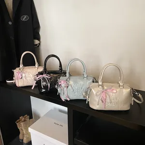 Stylish Boston pillow bags in pink, black, blue and gold with bow pearl charms