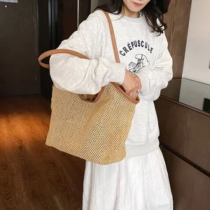 Large mesh woven beach tote bag with brown leather handles for women's summer vacation
