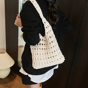 White hand-woven hollow knit shoulder bag with large capacity in casual tote style