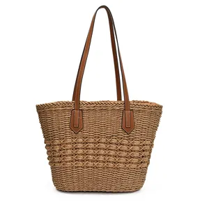 Large straw woven tote bag with brown leather handles for summer beach vacations
