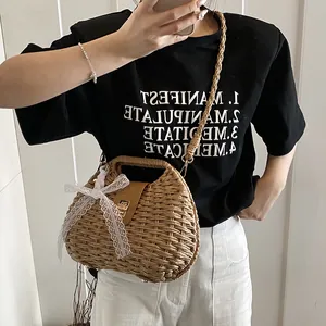 Handmade straw crossbody bag with leather flap and lace bow for beach vacation