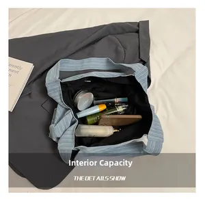 Internal capacity of light blue corduroy tote bag showing spacious lining and zip pocket