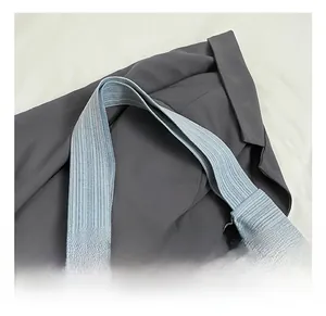 Detail shot of the wide striped canvas handle on this casual blue tote shopping bag