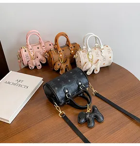 Detailed view of luxury Boston bags in four colors with bear prints and elephant charms