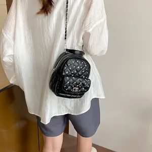 Chic quilted black mini backpack with sparkling rhinestones and silver chain straps