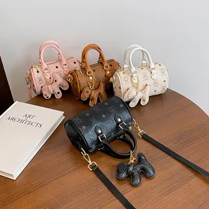 Mini Boston cylinder bags in pink, brown, white and black with cute dog charms
