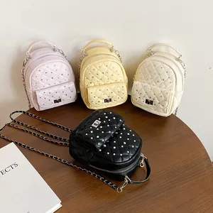 Quilted mini backpacks with rhinestones and chain straps in four vibrant colors
