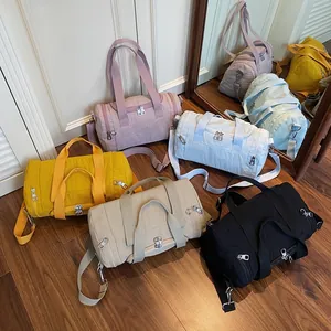 Minimalist nylon cylindrical shoulder bag for women in various trendy pastel colors