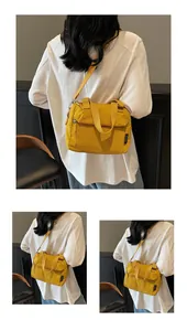 Détails du sac bandoulière en nylon jaune avec poches zippées et bandoulière réglable