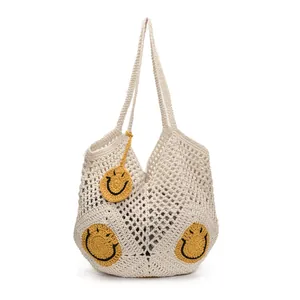 Straw beach tote with smiley face patches and charm for summer vacation styling