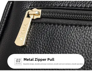 Close-up of litchi texture black leather and engraved light gold hardware zipper pull