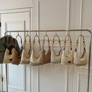 Handmade woven hobo beach bag with wooden bead handle and stylish striped pattern