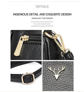 Detail of golden deer logo, YNXS zipper, and metal hardware on black pebble leather bag