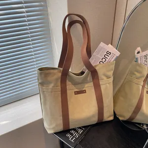 Grand Sac Cabas en Toile pour Femmes Polyvalent Simple Sac à Épaule Navette Poche Avant Style Littéraire Sac d'École