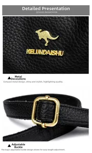 Makroaufnahme des goldenen Känguru-Logos und der Metallschnalle auf schwarzem Leder
