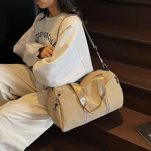 Large khaki nylon travel bag with crossbody strap for fitness and short trips