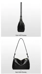 Detail view showing black oil-wax leather texture and golden zipper of Boston bag