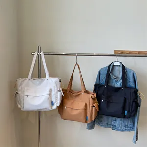 Minimalist large capacity nylon crossbody bag in white brown and black colors