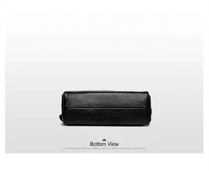 Detail view of the black leather Boston bag bottom showing premium pebbled texture
