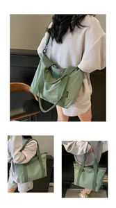 Détail du grand sac cabas vert avec bandoulière réglable et étiquette latérale