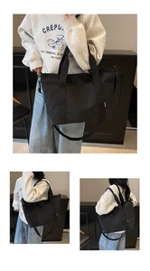Trois vues du grand sac fourre-tout noir avec bandoulière réglable et étiquette Shuo