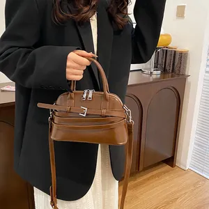 Classic dark brown PU leather shell bag with dual metal zippers and adjustable shoulder strap