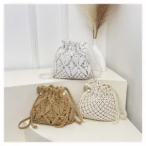 Three handmade macrame bucket bags in white beige and khaki with drawstring closure