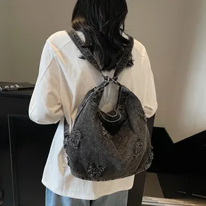 Chic dark gray washed denim tote bag with distressed alphabet patches and shoulder straps