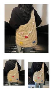 Detailed crochet texture of the beige woven tote bag with colorful bows and beads