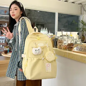Sac à dos scolaire jaune pastel à grande capacité avec peluche chat et mini pochette