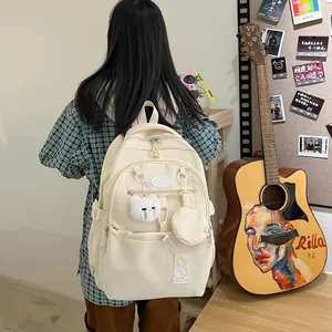 Sac à dos d'école beige pour filles avec détails d'étoiles et pendentif chat en peluche