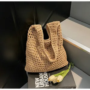 Detail of hollow-out weave bucket bag showing intricate texture and fabric inner lining